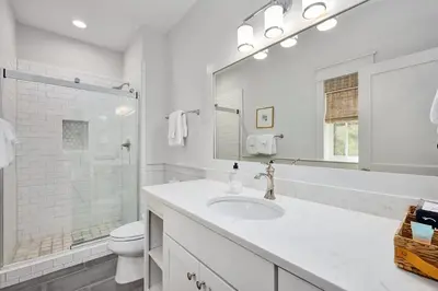 a white bathroom with a sink and a toilet at Naut 4 Sail by Oversee 30A in Seacrest