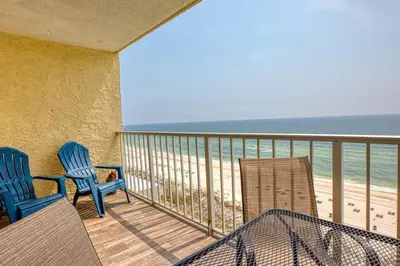 a balcony with two chairs and a view of the beach at -BeachFront Premium-Summit 1124 in Panama City Beach