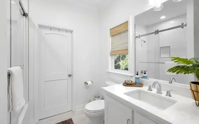 a white bathroom with a sink and a toilet at Sweet Lu-Sea by Oversee 30A in Santa Rosa Beach