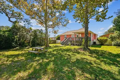 a picnic table in the yard of a house at 2340 Grand Oaks Ln home in Panama City Beach