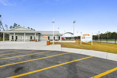 a parking lot in front of a building at 2340 Grand Oaks Ln home in Panama City Beach