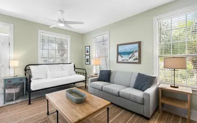 a living room with a couch and a table at Casa Playa by Oversee 30A in Santa Rosa Beach