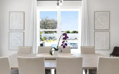 a dining room with a table and chairs and a window at Coconut Cove by Oversee 30A in Santa Rosa Beach