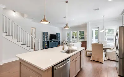 a kitchen with a sink and a counter top at Coral Retreat by Oversee 30A in Seacrest