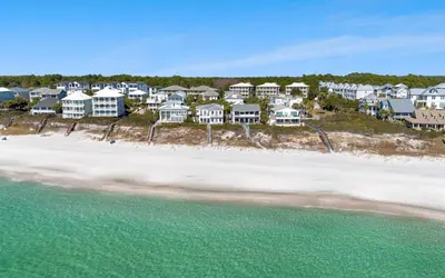 an aerial view of a beach with houses at Dolphin Run by Oversee 30A in Santa Rosa Beach