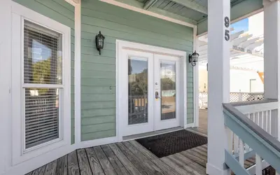 a front door of a house with a porch at Dolphin Run by Oversee 30A in Santa Rosa Beach