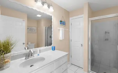 a white bathroom with a sink and a shower at Dolphin Run by Oversee 30A in Santa Rosa Beach