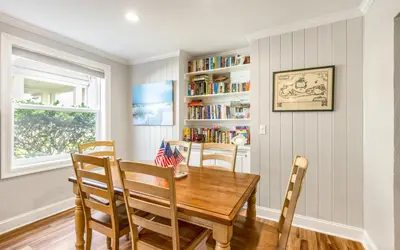 a dining room with a wooden table and chairs at Family Ties by Oversee 30A in Santa Rosa Beach