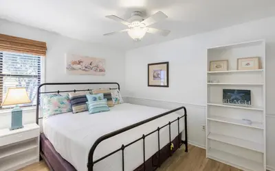 a bedroom with a bed and a ceiling fan at Go Coastal by Oversee 30A in Santa Rosa Beach