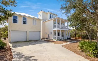 a large white house with a garage at Good Life At The C by Oversee 30A in Seacrest