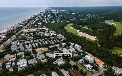 an aerial view of a subdivision of houses next to the beach at Good Life At The C by Oversee 30A in Seacrest