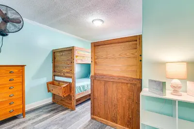 a bedroom with a bunk bed and a closet at Panama City Home with Fire Pit - Walk to Beaches! in Panama City Beach