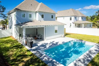a house with a swimming pool in the yard at Inlet Beach Paradise by Oversee 30A in Inlet Beach