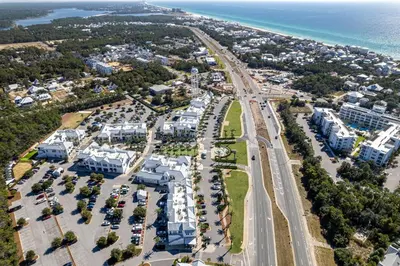 an aerial view of a resort complex next to the ocean at Inlet Beach Paradise by Oversee 30A in Inlet Beach