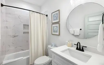 a white bathroom with a sink and a mirror at Inlet Beach Paradise by Oversee 30A in Inlet Beach