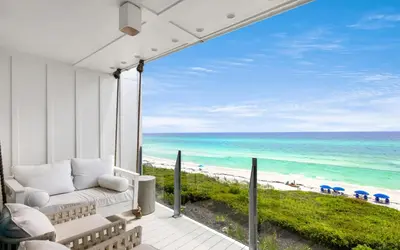 a view of the beach from the balcony of a beach house at Into the Mystic by Oversee 30A in Seacrest
