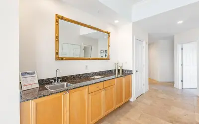 a bathroom with a sink and a mirror at Legacy 201 Emerald Beach by Oversee 30A in Santa Rosa Beach