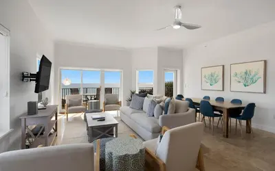 a living room with a couch and a table at Legacy 201 Emerald Beach by Oversee 30A in Santa Rosa Beach