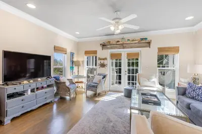 a living room with a flat screen tv at Lemon Squeezy by Oversee 30A in Inlet Beach