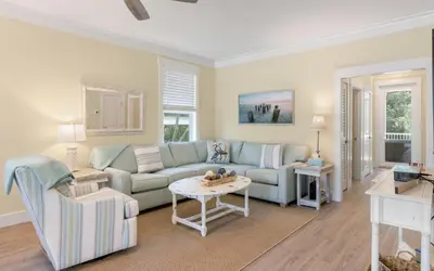 a living room with a couch and a table at Lofty Oasis by Oversee 30A in Santa Rosa Beach