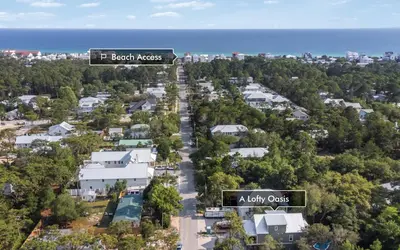 an aerial view of a residential neighbourhood with two street signs at Lofty Oasis by Oversee 30A in Santa Rosa Beach