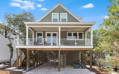 a house with a wrap around deck at Lofty Oasis by Oversee 30A in Santa Rosa Beach