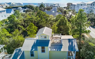 an aerial view of a house with blue and white at Mellow Yellow by Oversee 30A in Santa Rosa Beach
