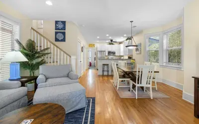 a living room with a couch and a table at Mellow Yellow by Oversee 30A in Santa Rosa Beach