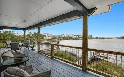 a deck with a view of the water at Noras Place by Oversee 30A in Santa Rosa Beach