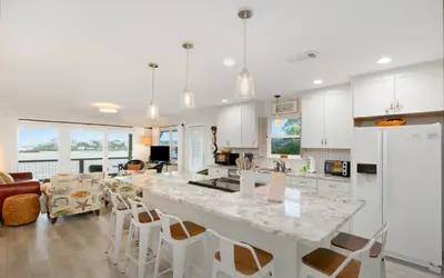 a kitchen with a large white counter top in a room at Noras Place by Oversee 30A in Santa Rosa Beach