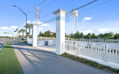 a white fence on the side of a road at Sea Bliss Cottage by Oversee 30A in Inlet Beach
