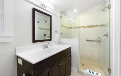 a bathroom with a sink and a shower at SeaGroovInn by Oversee 30A in Santa Rosa Beach