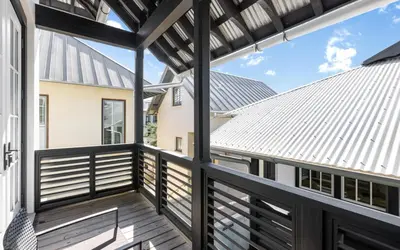 a view from the balcony of a home with a metal roof at Serenity by Oversee 30A in Rosemary Beach