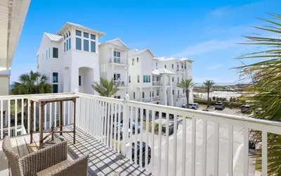 a view from the balcony of a white house at Shoreline 9 Unit 5 by Oversee 30A in Inlet Beach