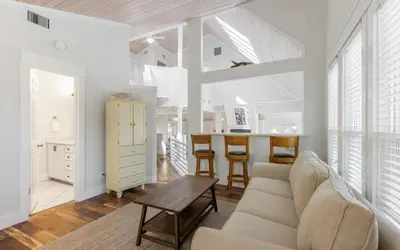 a living room with a couch and a table at Shores Fun by Oversee 30A in Seacrest