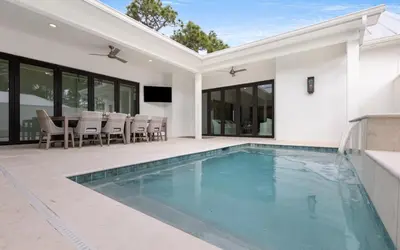 a swimming pool in the backyard of a house at Slim Shady by Oversee 30A in Santa Rosa Beach