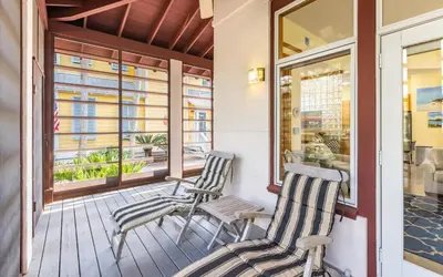two chairs on the front porch of a house at Special Purpose by Oversee 30A in Santa Rosa Beach