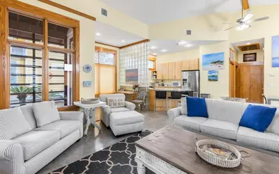 a living room with two couches and a table at Special Purpose by Oversee 30A in Santa Rosa Beach
