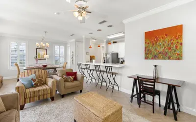 a living room with a dining room and a kitchen at Splish Splash by Oversee 30A in Seacrest