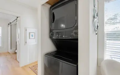 a kitchen with a black refrigerator and a microwave at Sun Palace by Oversee 30A in Santa Rosa Beach