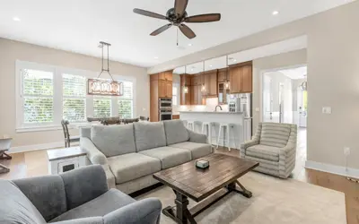 a living room with a couch and a table at Sunseeker by Oversee 30A in Santa Rosa Beach