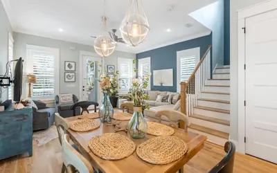 a dining room with a table and chairs at Surfing Cowboy by Oversee 30A in Santa Rosa Beach