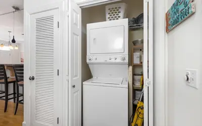 a kitchen with a refrigerator and a microwave at The Fab Crab by Oversee 30A in Seacrest