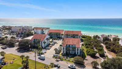 an aerial view of a resort next to the ocean at The Palms by Oversee 30A in Santa Rosa Beach