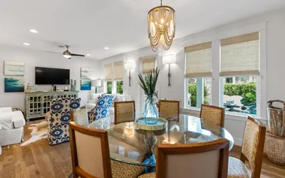 a dining room and living room with a table and chairs at The Round Up by Oversee 30A in Inlet Beach