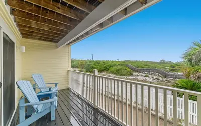 two chairs on a porch with a view of the ocean at Tucked-Away at Inlet Beach by Oversee 30A in Inlet Beach