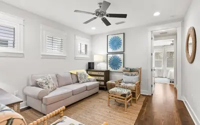 a living room with a couch and chairs at Two Rocking Chairs on a Porch by Oversee 30A in Watersound Beach