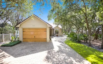 a house with a garage and a driveway at Villa Bon Secour by Oversee 30A in Seacrest
