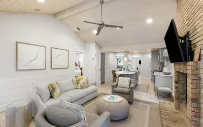 a living room with a couch and a table at Villa Bon Secour by Oversee 30A in Seacrest