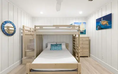 a bedroom with a bunk bed and a bunk bed frame at Villa Bon Secour by Oversee 30A in Seacrest